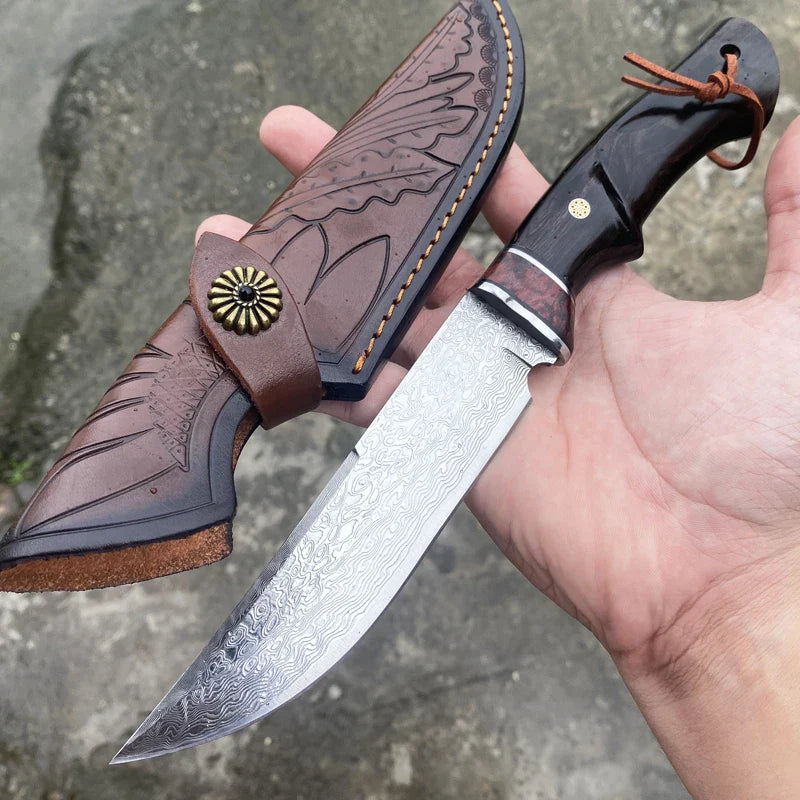 VG10 Damascus hunting knife with patterned blade and dark wooden handle held alongside engraved leather sheath